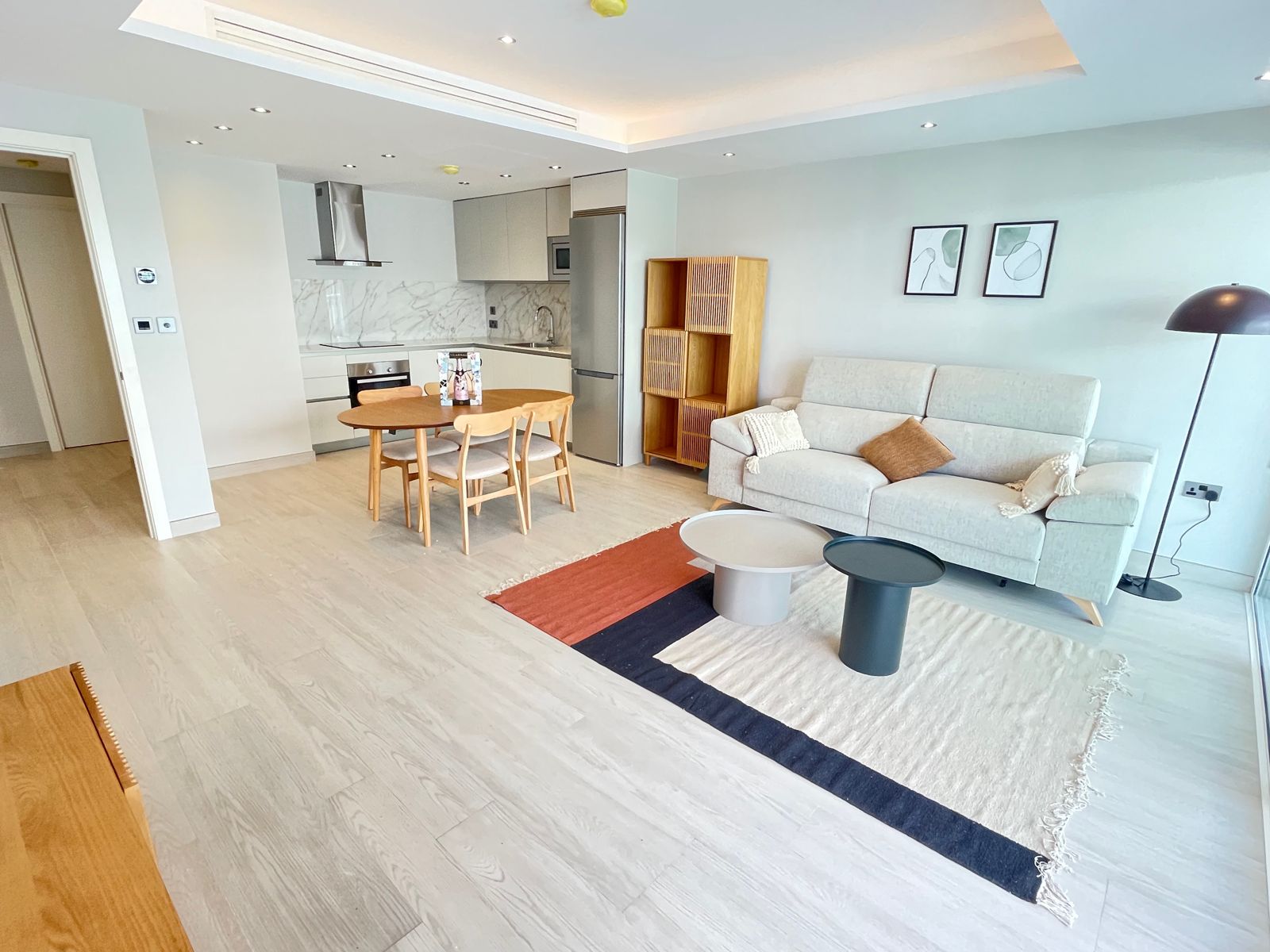 Living room with open kitchen and dining table